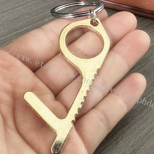 Veilige draagbare EDC-deuropener Sleutelhanger zonder aanraking Draagbare EDC-deuropener Sleutelhanger Stylus Liftknop Contactloos gereedschap