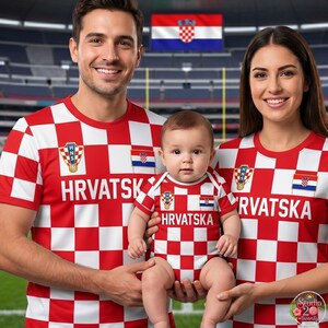 May include: Matching red and white checkered shirts and a baby bodysuit featuring the Croatian national emblem, the HNS logo, and the text HRVATSKA. The garments display a consistent red and white square pattern across the fabric.