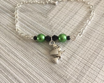 Witching hour charm bracelet, cute tiny witch charm, green witch charm bracelet, witch on broomstick bracelet, work halloween costume,