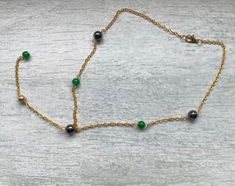 Vibrant gold necklace with semi precious chunky hematite and chalcedony beads, bright green and gold necklace, long drop pendant necklace.
