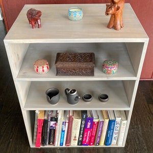 Custom made solid wood bookshelf. Solid pine. Contact me for custom sizes, number of shelves, stain or paint colors.