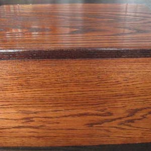 Solid oak storage box with hinged lid. Contact me for custom sizes, engraving requests, colors, finishes. Pricing  varies.