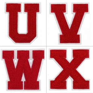 May include: Four red felt letters with white outlines. The letters are U, V, W, and X.