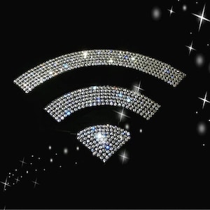May include: A wifi symbol made of sparkling rhinestones on a black background.