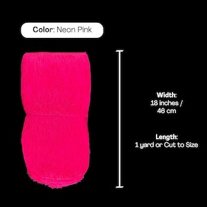 May include: A neon pink fringe trim with a width of 46 cm. The text on the image specifies the colour as Neon Pink, the width as 46 cm, and the length as 1 yard or cut to size. The fringe consists of long, thin, vertical strands.