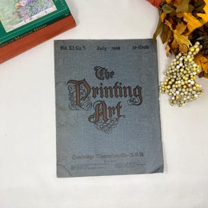 May include: A vintage magazine cover with a blue background and the title "The Printing Art" in brown lettering. The magazine is from July 1908 and is titled "Vol. XI-No.5" and "30-Cents".