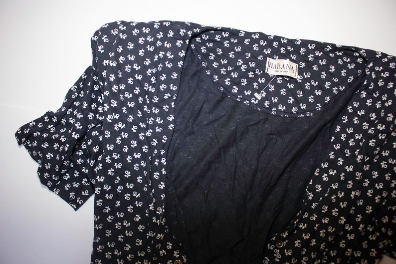Blue long jumpsuit with 90s short-sleeved floral pattern