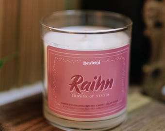 Licensed Raihn Candle [8.5oz] | Desert Sands, Amber, Citrus | Crowns of Nyaxia Bookish Merch