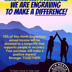 Puede incluir: Dos siluetas de personas levantando los brazos en el aire en la cima de una monta&ntilde;a contra un cielo azul con nubes amarillas. El texto "MORE THAN JUST A BUSINESS... WE ARE ENGRAVING TO MAKE A DIFFERENCE!" est&aacute; en la parte superior de la imagen. El texto "10% of Aim North Engraving's annual income will be donated to a nonprofit that supports people in recovery. Your purchase will make a positive impact! Stronger TOGETHER!" est&aacute; en el medio de la imagen. El texto "To learn more or how your organization can be a recipient of this donation, email us aim.north.engraving@gmail.com" est&aacute; en la parte inferior de la imagen. Un logotipo de Aim North Engraving est&aacute; en la esquina inferior derecha de la imagen.
