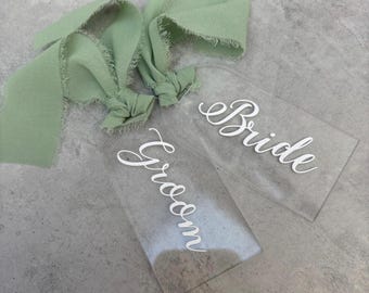 Personalised Perspex place cards with ribbon and vinyl