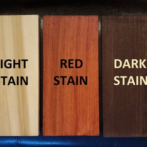 May include: Three wood samples showing different wood stain colors: light stain, red stain, and dark stain.