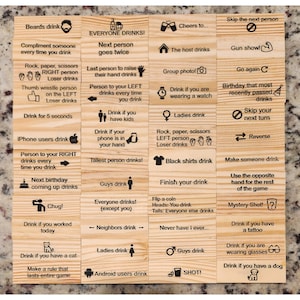 May include: A wooden drinking game with various instructions printed on individual blocks. Instructions include "Everyone drinks!", "Drink if you have a cat", and "Skip the next person". The game is designed for group participation.
