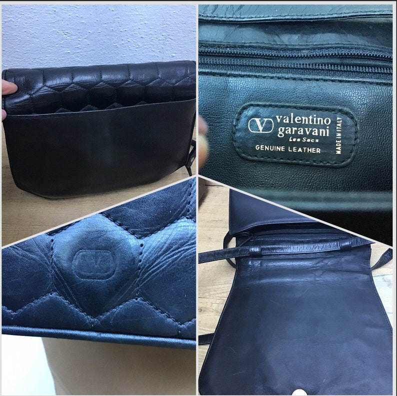 May include: Black leather Valentino Garavani shoulder bag. The bag has a quilted flap and a smooth leather body. The interior is visible, and it has a long strap. The label reads "Valentino Garavani Les Sacs Genuine Leather Made in Italy."