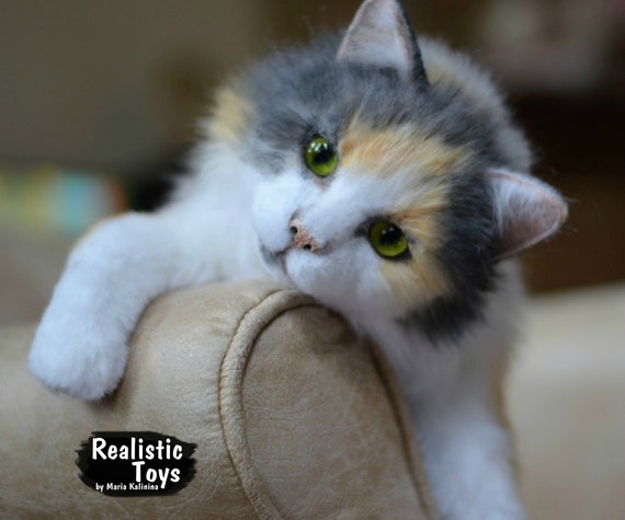 realistic stuffed calico cat