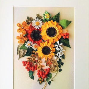 Paper quilling art with sunflowers and berries