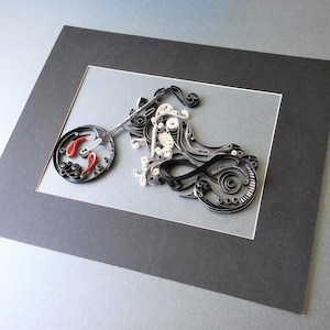 May include: A black and white paper quilling artwork of a motorcycle. The motorcycle is framed in a black mount with a white border.