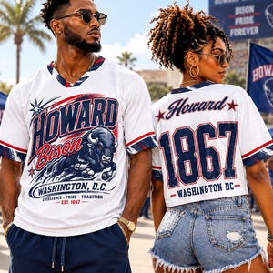 May include: A white mesh jersey featuring the text Howard Bison Washington, D.C. Excellence Pride Tradition Est. 1867 on the front, and a white jersey with Howard 1867 Washington DC on the back, both with navy blue and red accents and bison graphics.