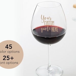 May include: A large wine glass filled with red wine, with the text "Your CUSTOM quote HERE" in gold. A tan circle displays "45 colour options" and "25+ font options".