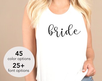 May include: White tank top with the word "bride" in black script. The image also includes a graphic with the text "45 color options" and "25+ font options".
