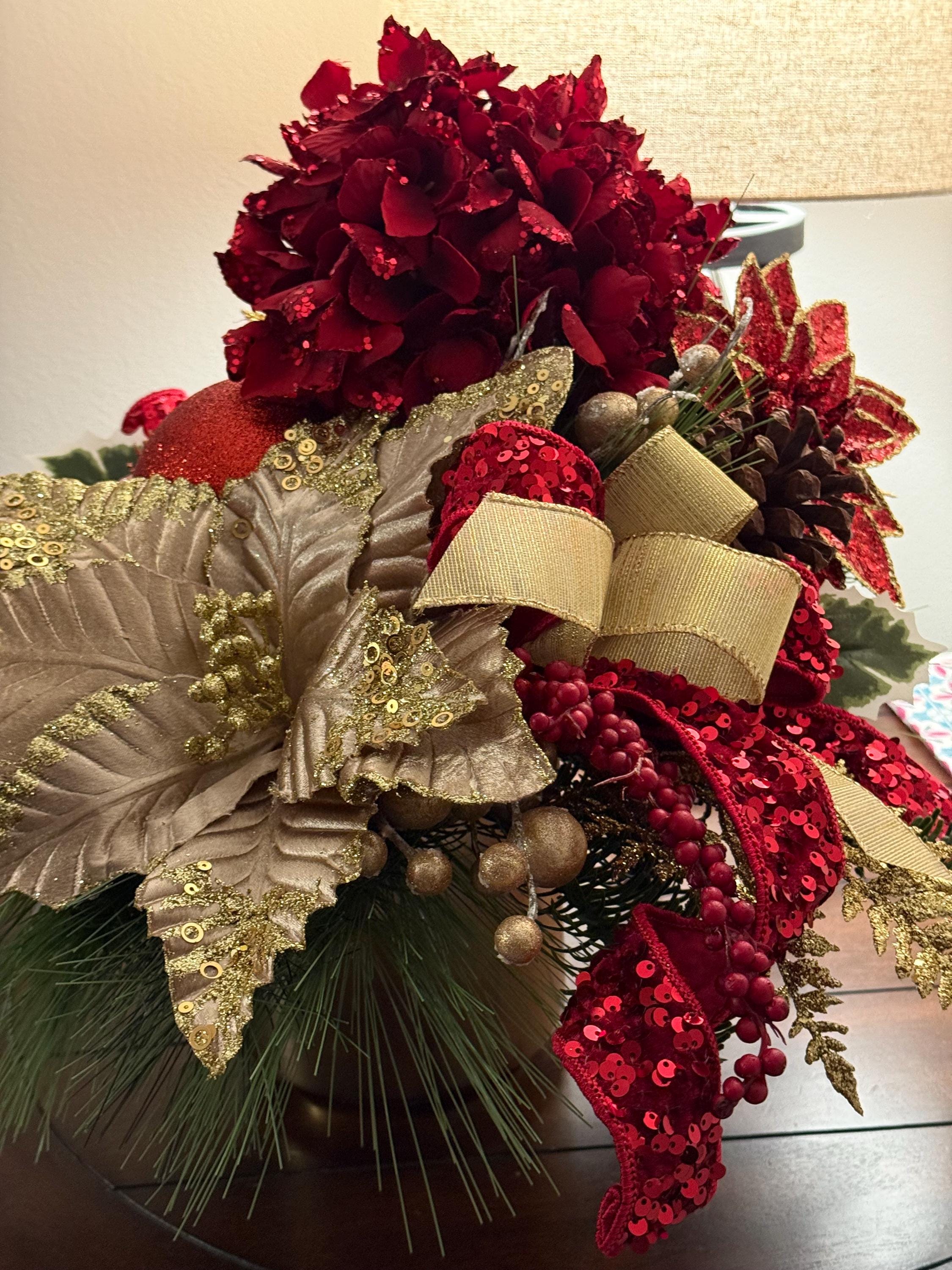 30 Beautiful Christmas Flower Arrangements for a Blooming Holiday: Festive Floral Ideas to Brighten Your Home 5 Red & Gold Christmas Floral Centerpiece with Sequined Ribbon
