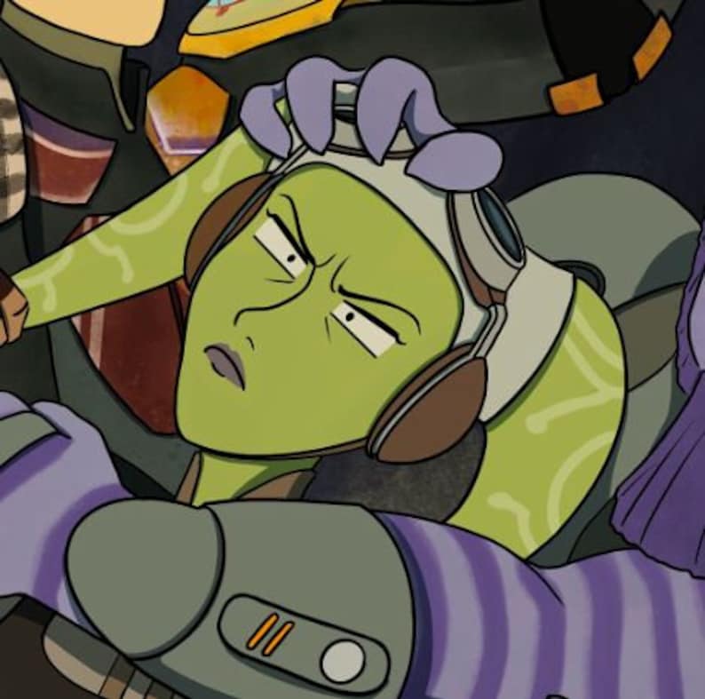 May include: A green-skinned character with large eyes and a purple headband is being held down by another character. The character being held down is wearing a large, brown headset.