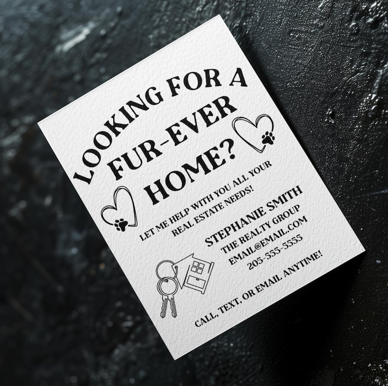 May include: Black and white business card with the text "Looking for a fur-ever home?" and a paw print heart. The card also includes the text "Let me help with you all your real estate needs!" and contact information for Stephanie Smith, The Realty Group.