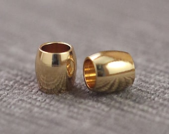 以下が含まれることがあります： ジュエリー作りのための、金色の金属製のビーズストッパー2個