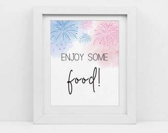 May include: White framed sign with a watercolor background of pink and blue fireworks. The text on the sign reads "ENJOY SOME food!"