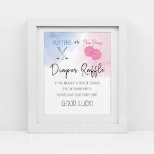 May include: A white frame with a blue and pink watercolor background. The text "PUTTERS or Pom Poms" is at the top of the sign.  The text "Diaper Raffle" is in a larger font below the text at the top.  The text "IF YOU BROUGHT A PACK OF DIAPERS FOR THE DIAPER RAFFLE PLEASE LEAVE YOUR TICKET HERE. GOOD LUCK!" is at the bottom of the sign.