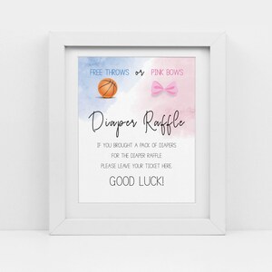 May include: A white frame with a sign inside that says "Free Throws or Pink Bows Diaper Raffle". The sign has a basketball and a pink bow on it. The text below says "If you brought a pack of diapers for the diaper raffle please leave your ticket here. Good Luck!"