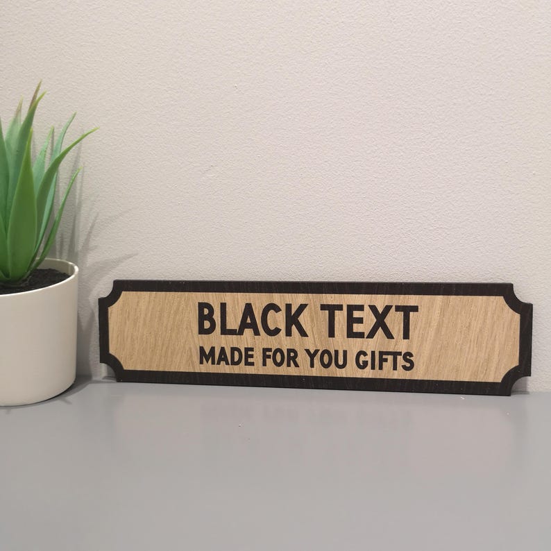 May include: A wooden sign with a black border and black text that reads "BLACK TEXT MADE FOR YOU GIFTS".