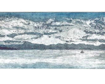 May include: A rectangular print depicting a seascape with a sailboat. The artwork features a cloudy sky in shades of blue and white, with a dark mountain range in the distance. The water reflects the sky's colors.