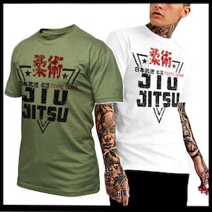 May include: Two t-shirts with a graphic design featuring the Japanese characters for "柔術" (Jujutsu) and the text "Jiu Jitsu" in a distressed font. The t-shirts are in olive green and white.