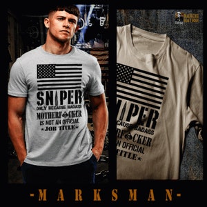 May include: A gray t-shirt with a black and white American flag design and the text "Sniper Only Because Badass Motherfcker Is Not An Official *Job Title*" printed on the front.