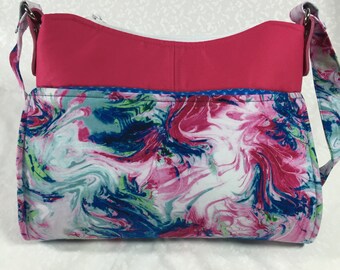 Blue and Pink Pint Swirles in this sassy "Gabby Bag", with a zippered top and shoulder length handles.