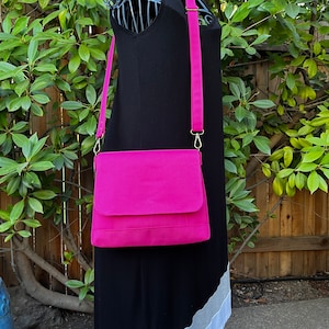 Pink Iris Crossbody Bag, Waterproof Canvas, Print interior, Simple, yet elegant with adjustable strap and interior zipper pocket.
