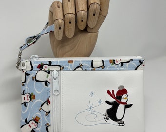 Ice Skating Penguin, Zippy Clutch/Wristlet, Top zipper closure, Vertical zipper pocket perfect for a small phone, glasses, keys or cards
