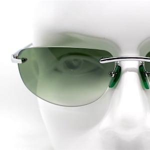Rectangular oval rimless sunglasses man woman green lens
