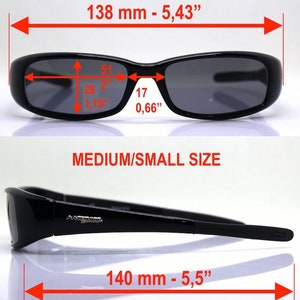May include: Black sunglasses with dark lenses. The glasses are 5.43 inches wide and 5.5 inches long. The lenses are 2 inches wide and 1.10 inches high. The frame is marked "MEDIUM/SMALL SIZE".