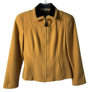 May include: A mustard yellow zip-up jacket with a black velvet collar.