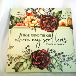 May include: Square print with floral watercolor design. The print features a quote from Song of Solomon, "I have found the one whom my soul loves." The flowers are in shades of red, yellow, and brown.