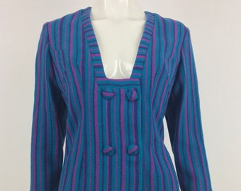 May include: A blue and purple striped knit cardigan with a deep V-neck and double breasted closure. The cardigan has a relaxed fit and is made of a soft, comfortable fabric.