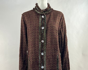 May include: A long, brown tweed jacket with green trim and white buttons. The jacket has a collar and pockets.