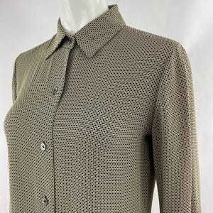 May include: A long-sleeved button-down shirt with a geometric pattern in black and beige.