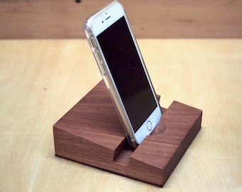 Phone or tablet stand made from flooded gum with a suede base.