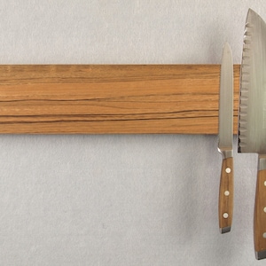 Luxury knife rack in New Guinea Walnut.