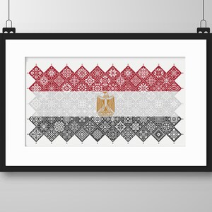 May include: A framed print of the Egyptian flag, made up of red, white, and black geometric patterns. The flag features a gold eagle in the center.