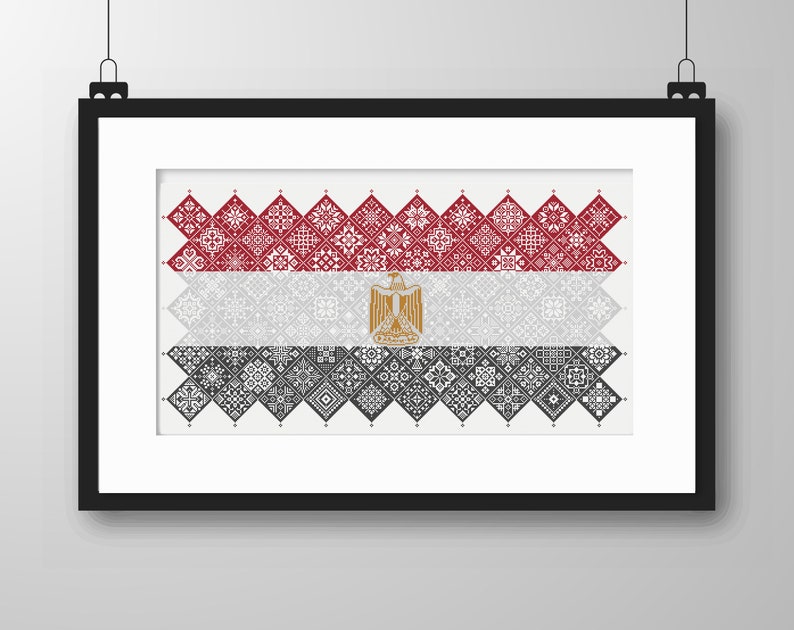 May include: A framed print of the Egyptian flag, made up of red, white, and black geometric patterns. The flag features a gold eagle in the center.