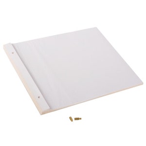 May include: A white, rectangular, blank sketchbook with a wooden spine and two brass fasteners. The sketchbook is lying flat on a white surface.