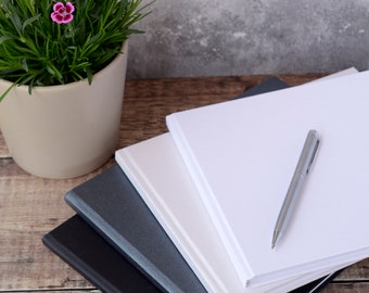 High Quality DIY Guest Book. Plain Guest Book available in White, Pearlescent Ivory, Charcoal or Black. 50 pages / 100 sides.